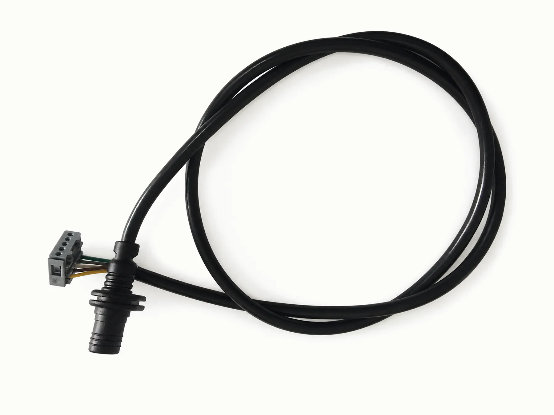 Black cable assembly with a molded circular connector and exposed conductors on a warm-white background